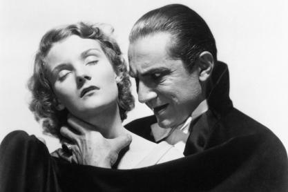 Helen Chandler (left) and Bela Lugosi (right) staring in Dracula. Lugosi prepares to bite Chandlers neck