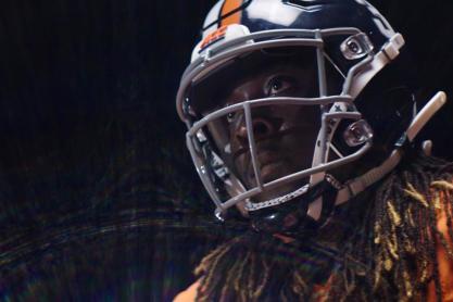 Up close image of a Football player wearing a helmet
