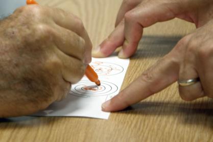 Man attempting to trace a spiral as a test before a procedure