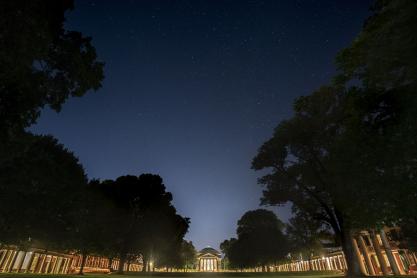 View of the Rotunda from the bottom of the lawn while the lawn and Rotunda are lit up