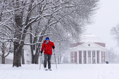 Person skiing across the Lawn with the Rotunda as a backdrop