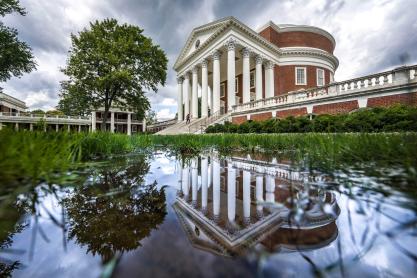 Water standing on the lawn reflecting the Rotunda