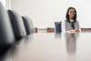 University of Virginia student and Board of Visitors member Lily Roberts sits at the end of a conference table.