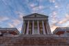 View of the Rotunda from the base of the stairs at sunset on the Grounds of University of Virginia