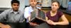 Aerospace engineering professor Chris Goyne, center, and students Chandrakanth “C.K.” Venigalla, left, and Robin Leiter are designing a mini satellite for a NASA experiment.