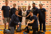 Team captain Mariah Kenny (holding trophy) is joined by teammates Roman Bohuk, Daniel Chen, Quintin DeGroot, Calvin Krist, Abbas Naderi, Paul Sanders and Jake Smith. 