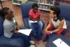 Darden School of Business professor Lalin Anik, right, talks with students at Saturday’s ESTEAM Conference for Girls at Albemarle High School.