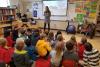 Peace Corps volunteer and 2017 UVA graduate Evan Steinberg talks with students at Charlottesville’s Peabody School about her time in Benin. (Contributed photo)