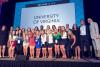 Students in professor Carrie Heilman’s “Promotions” class celebrate on stage in Chicago at the National Student Advertising Competition last week. 