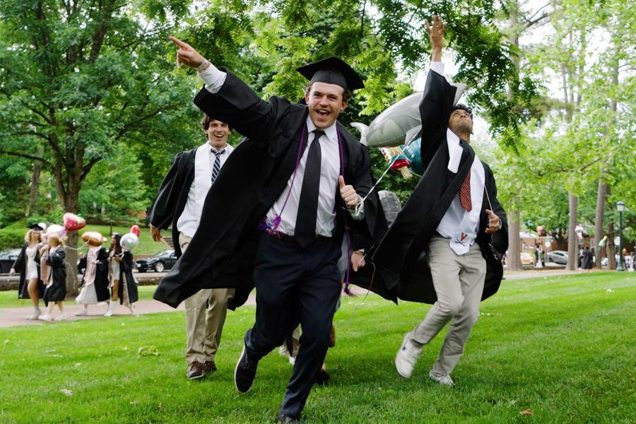 Graduates running and cheering during UVA‘s “Final Exercises 2025“