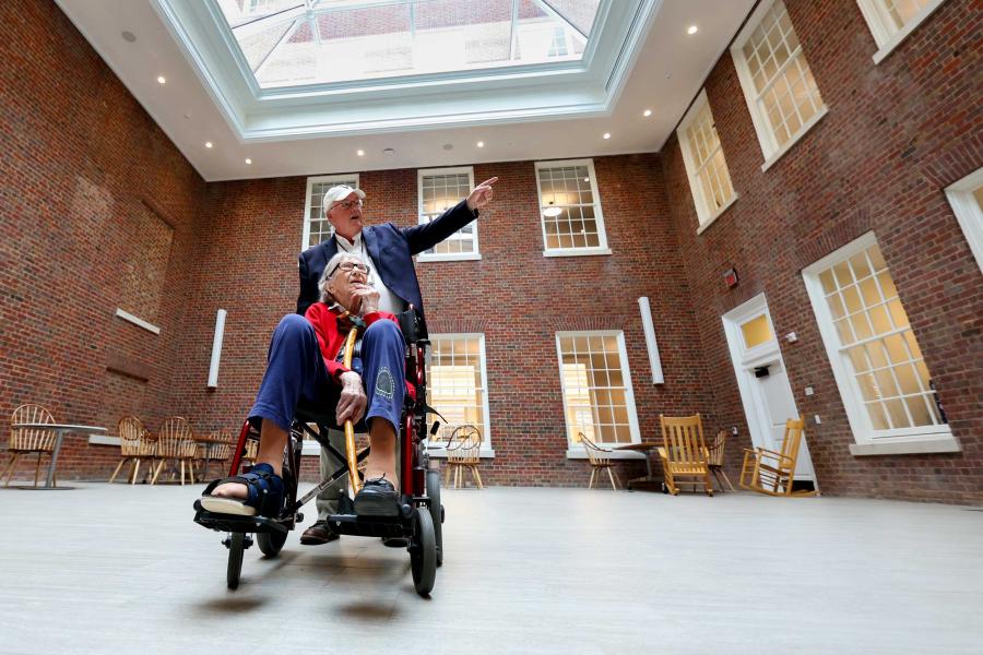 John Unsworth giving Mary Catherine Dunnigan a tour of the renovated UVA Shannon Library