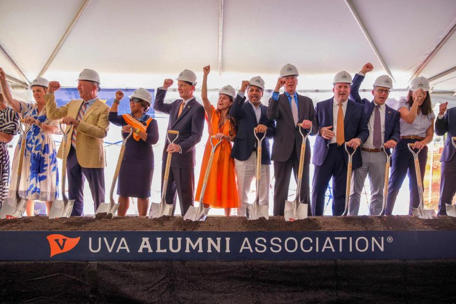 A portrait of UVA alumni and university officials singing 'The Good Old Song' during the ceremonial groundbreaking of Aggarwal Hall, the Alumni Association's new home.