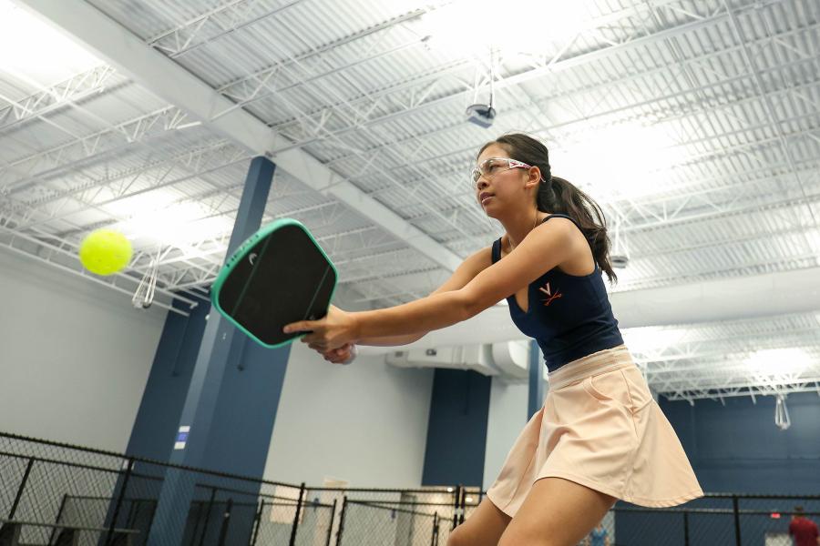 Vivianne Ngo returning a serve in pickleball.