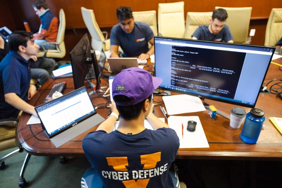 Portrait of UVA members of the Cyber Defense Team from left, Shreyas Mayya; Christopher Marotta, class of 2024.