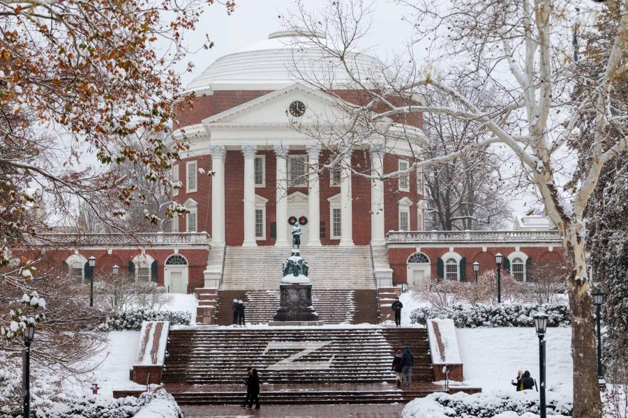 the UVA Rotunda covered in snow on a cloudy winter day