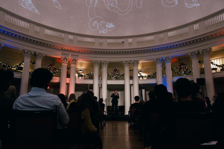 Portrait of people gathered to listen to the annual Double Take storytelling event inside the Rotunda Dome.