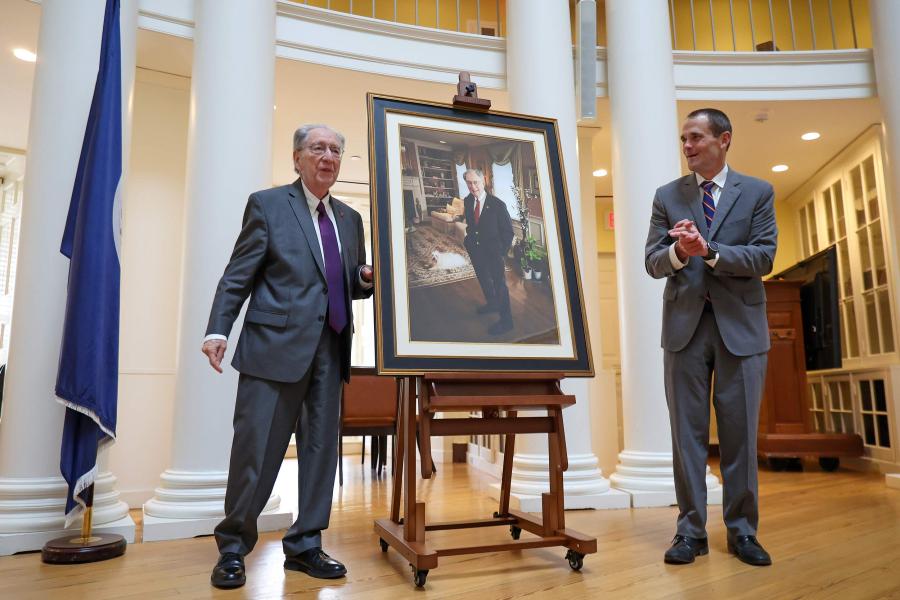 Joe Erdman, left, his presidential portrait, center, and UVA President Jim Ryan, right