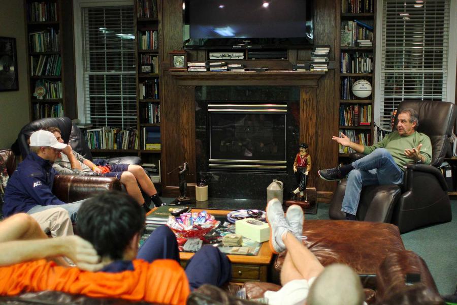 Bob Rotella sitting back in a comfy chair conversing with members of the UVA men’s golf team