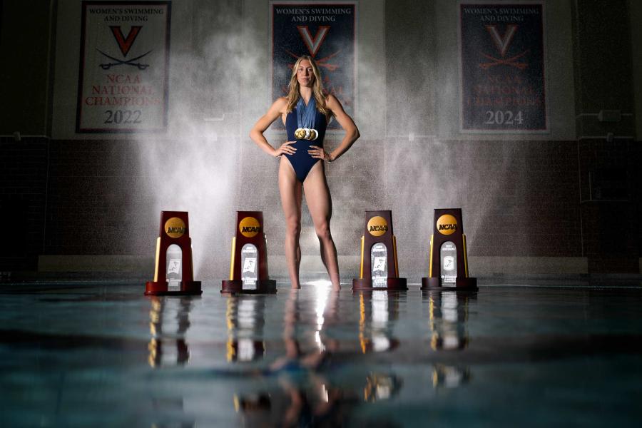 Gretchen Walsh at the UVA pool with her four NCAA Championship trophies and four Olympic medals