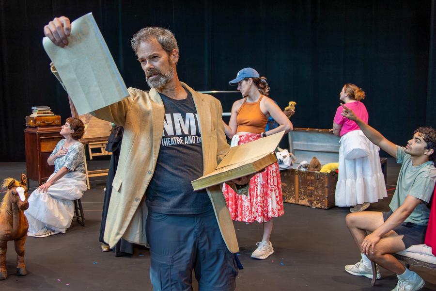 actors rehearsing a stage musical number