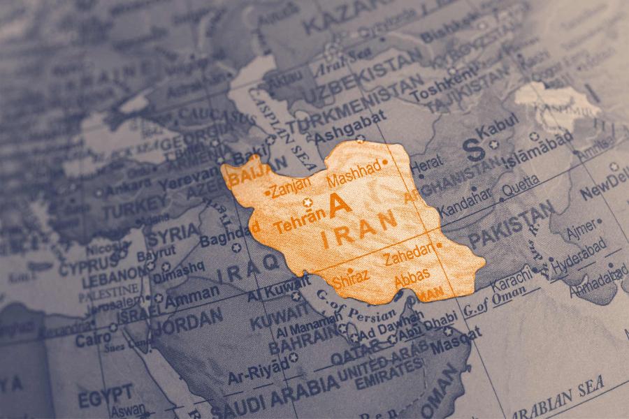 illustration of a globe with the country of Iran highlighted in orange