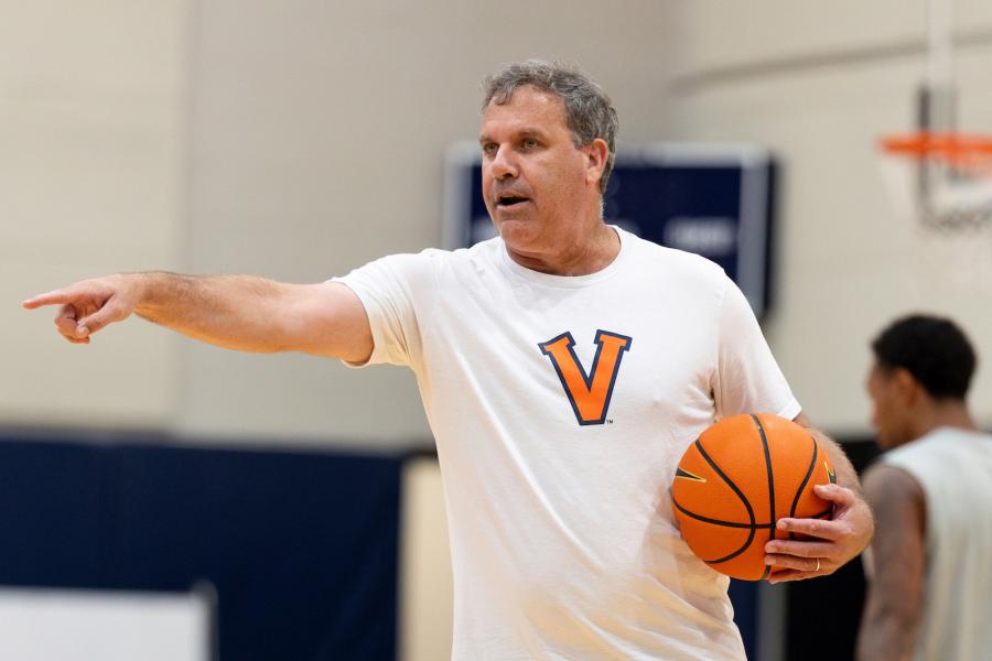 Candid of Griff Aldrich holding a basketball on a basketball court