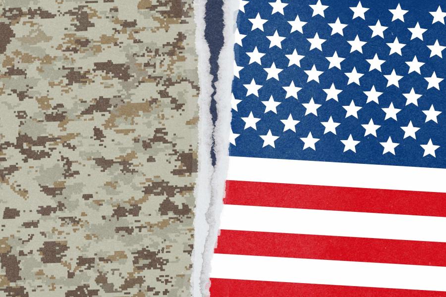 illustration of a camouflage pattern and the US flag being town apart from the center.