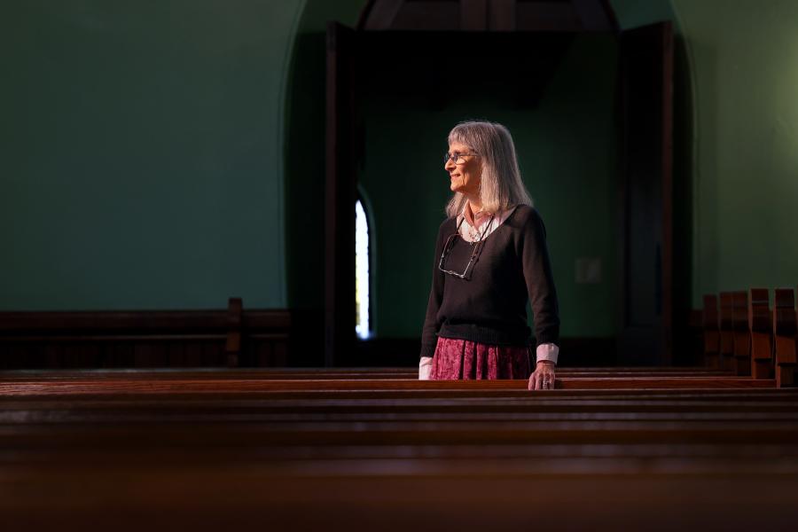 Candid photo of Barbara Moore inside the University of Virginia Chapel