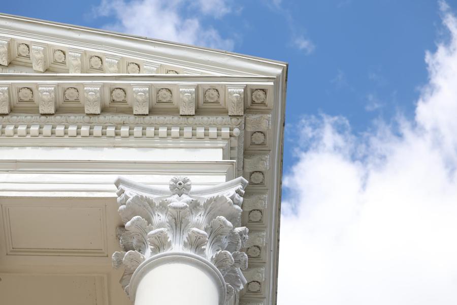 looking up at the capital of one column of the UVA Rotunda. 