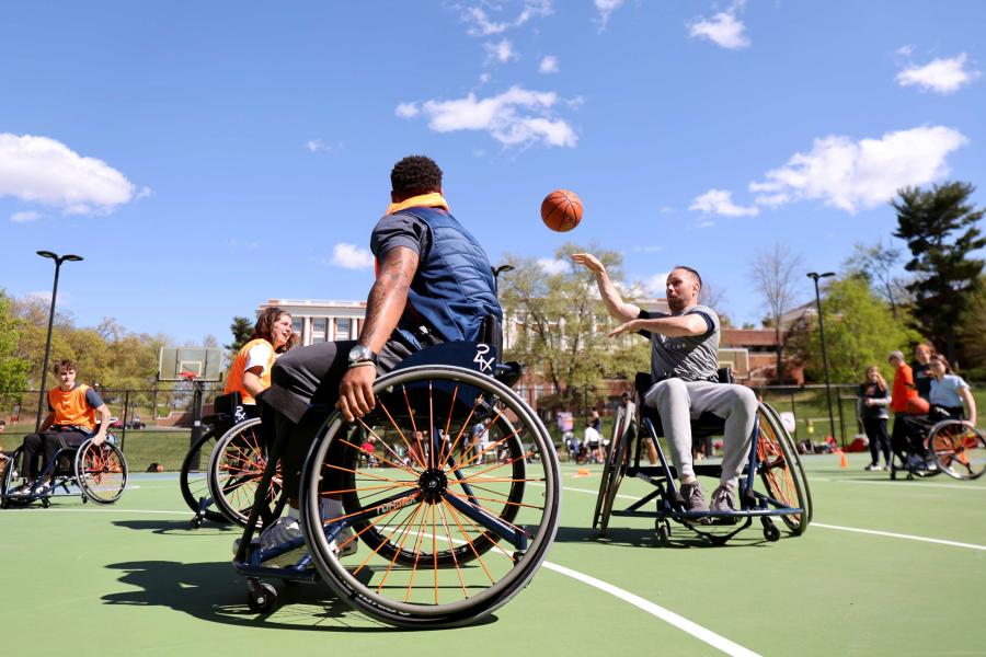 People playing a game of wheelchair basketball