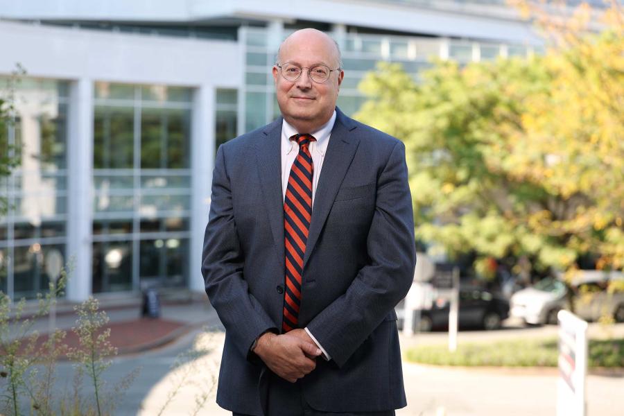 Dr. Mitchell Rosner standing in front of UVA hospital