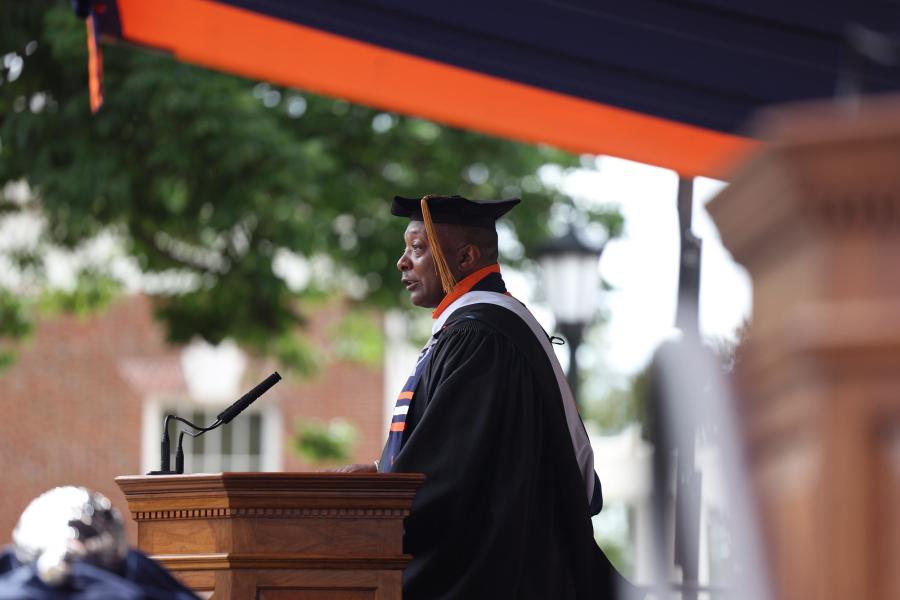 Cedric Rucker at the podium giving the keynote at UVA‘s Final Exercises 2025