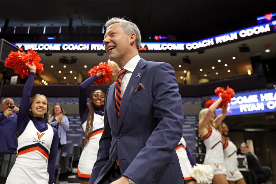 Ryan Odom walking onto the basketball court at John Paul Jones Arena