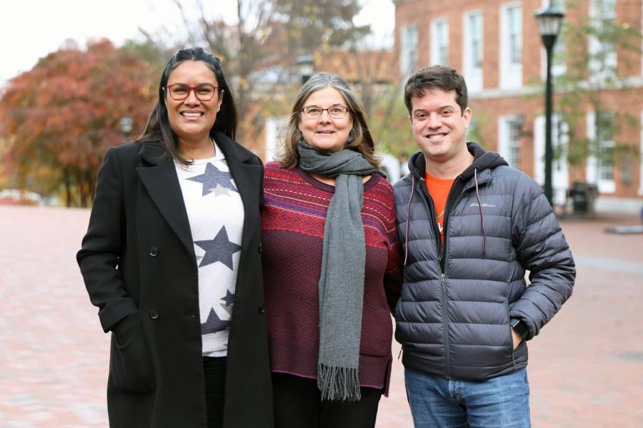 Host Helga Hiss, center, and guests Mônica Rodrigues, left, and Victor Ariel Leal Sobral standing on Grounds together