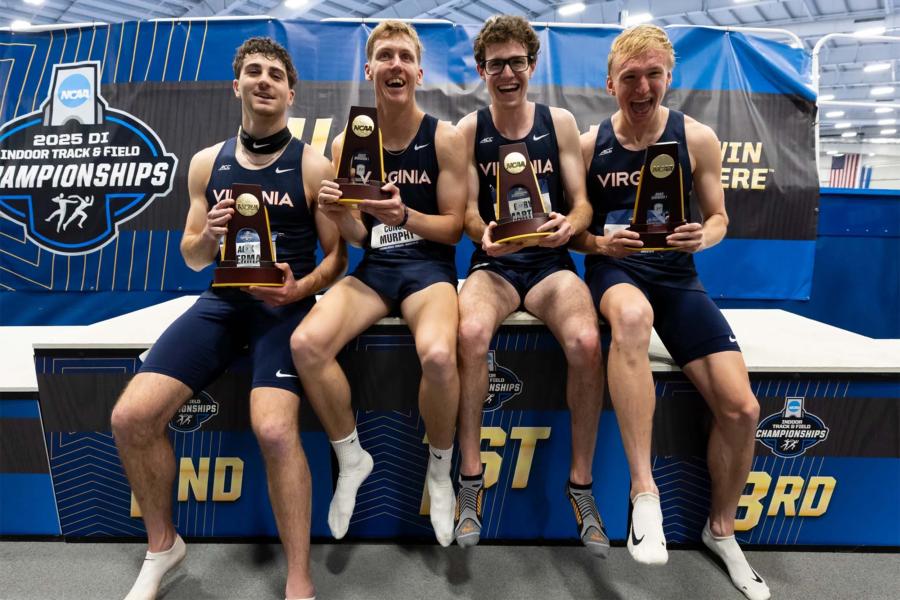 Portrait of UVA runners Alex Sherman, Conor Murphy, Gary Martin and Wes Porter celebrate their victory in the distance medley relay at the NCAA Indoor Championships.