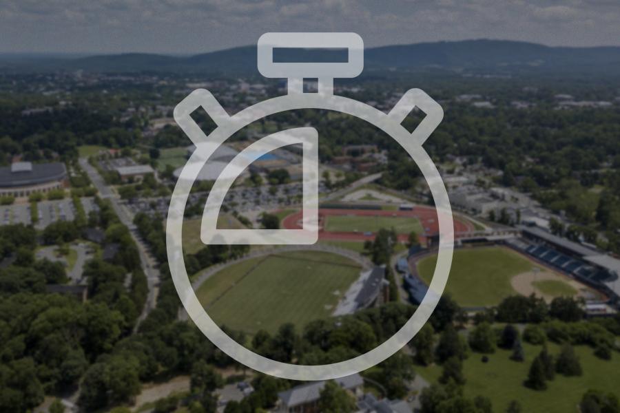 Illustration of a stopwatch over an aerial photo of the athletics facilities