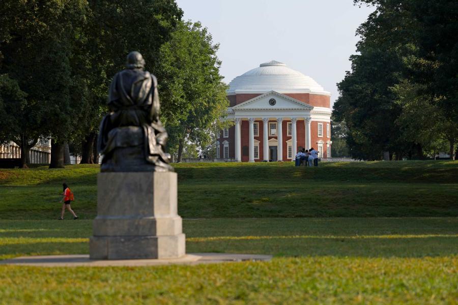 Portrait of the Homer statue viewed from behind, with the Rotunda in the background.