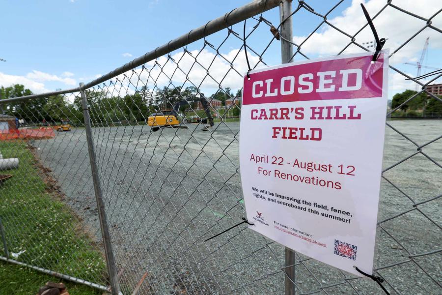 A fence around Carr's Hill Field with a closed sign on it