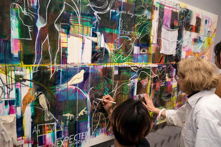 Students and faculty contributing to the ‘Fragile Beauty’ living art wall