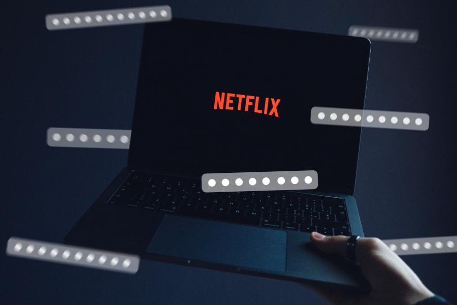 Laptop with Netflix logo on screen, with seven passwords floating around it