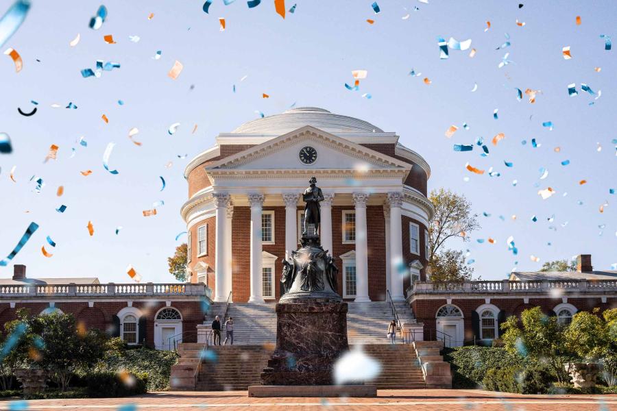 Illustration of orange, blue, and white confetti overlaying a photo of the Rotunda