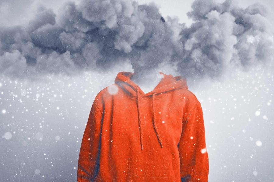 A figure in a hoodie with their face surrounded by snowy clouds