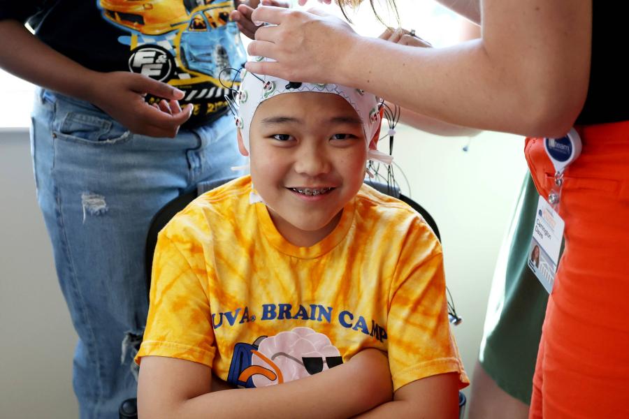 A child wearing an EEG cap to track activity in the brain