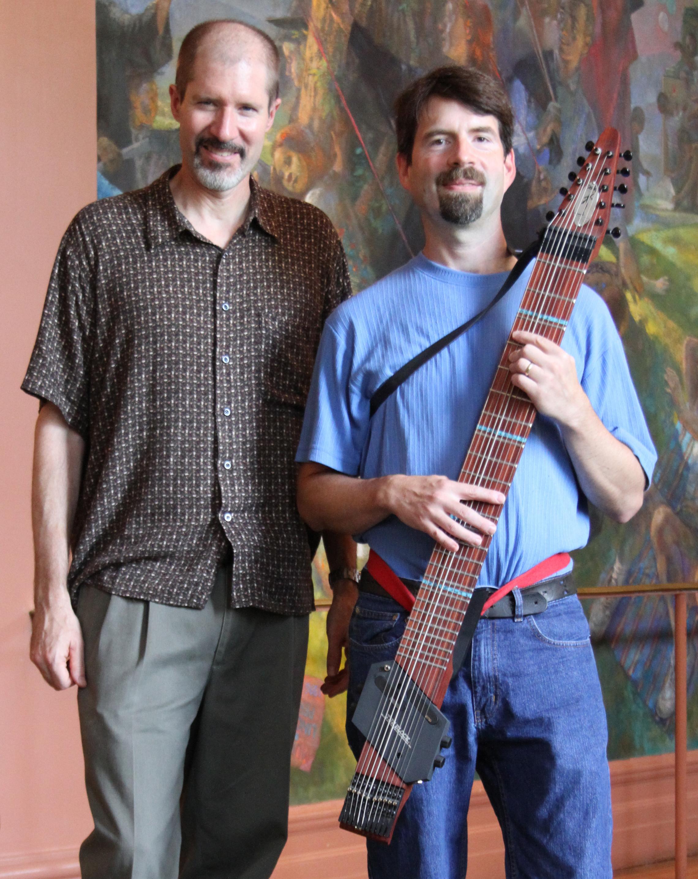 Music Department chair Richard Will and performance faculty member Greg Howard, right, show a new Chapman Stick recently donated to the department. Howard is a nationally recognized performer on the instrument.