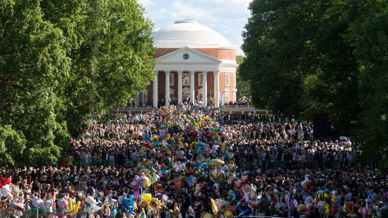 Looking down the Lawn towards the Rotunda at the sea of 2025 graduating students processing down the Lawn
