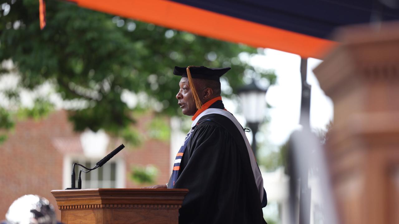 Cedric Rucker at the podium giving the keynote at UVA‘s Final Exercises 2025