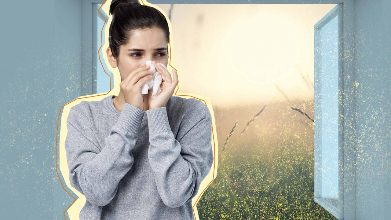 Woman blows nose while pollen spills into her house through an open window