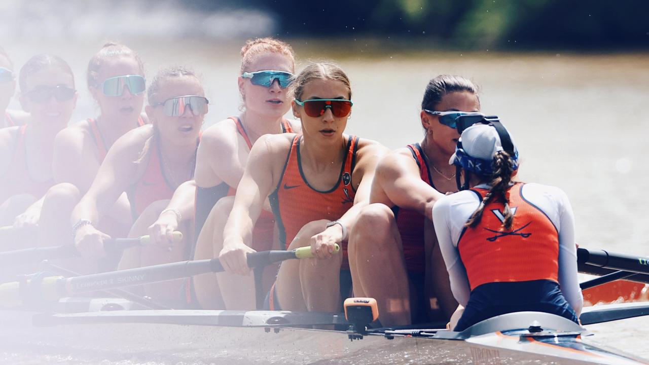 Skylar Dahl, in teal-rimmed sunglasses, with fellow crew mates in the middle of rowing.