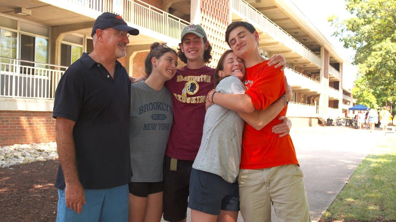  New student poses with parents and siblings