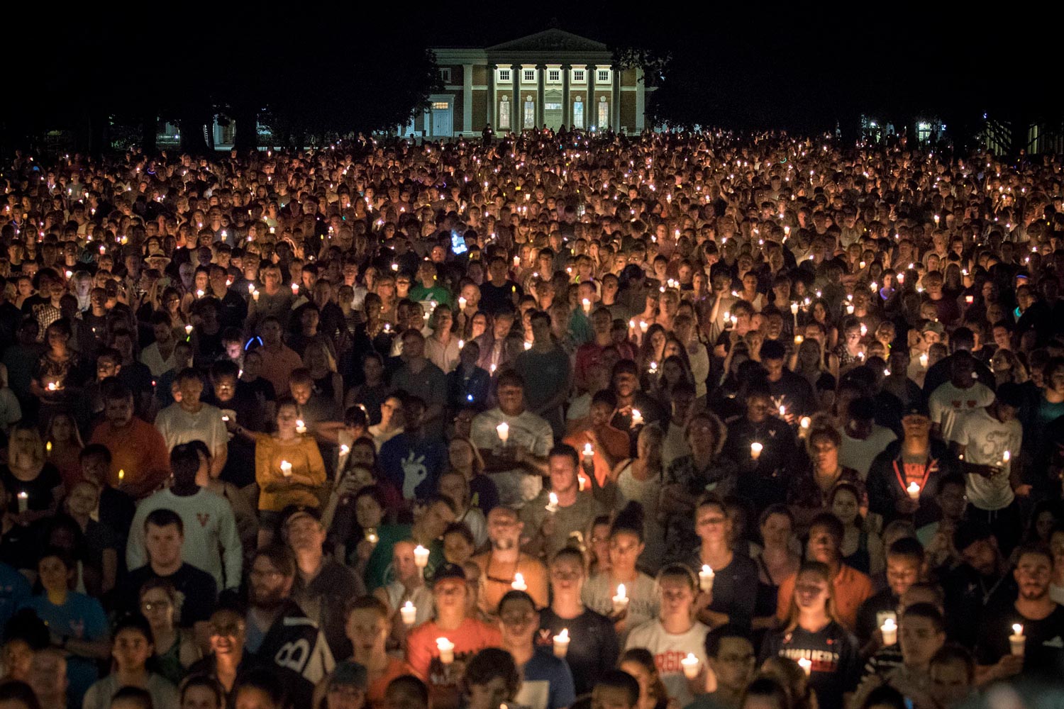 The Lawn filled with people holding candles